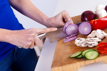 Person chopping onion